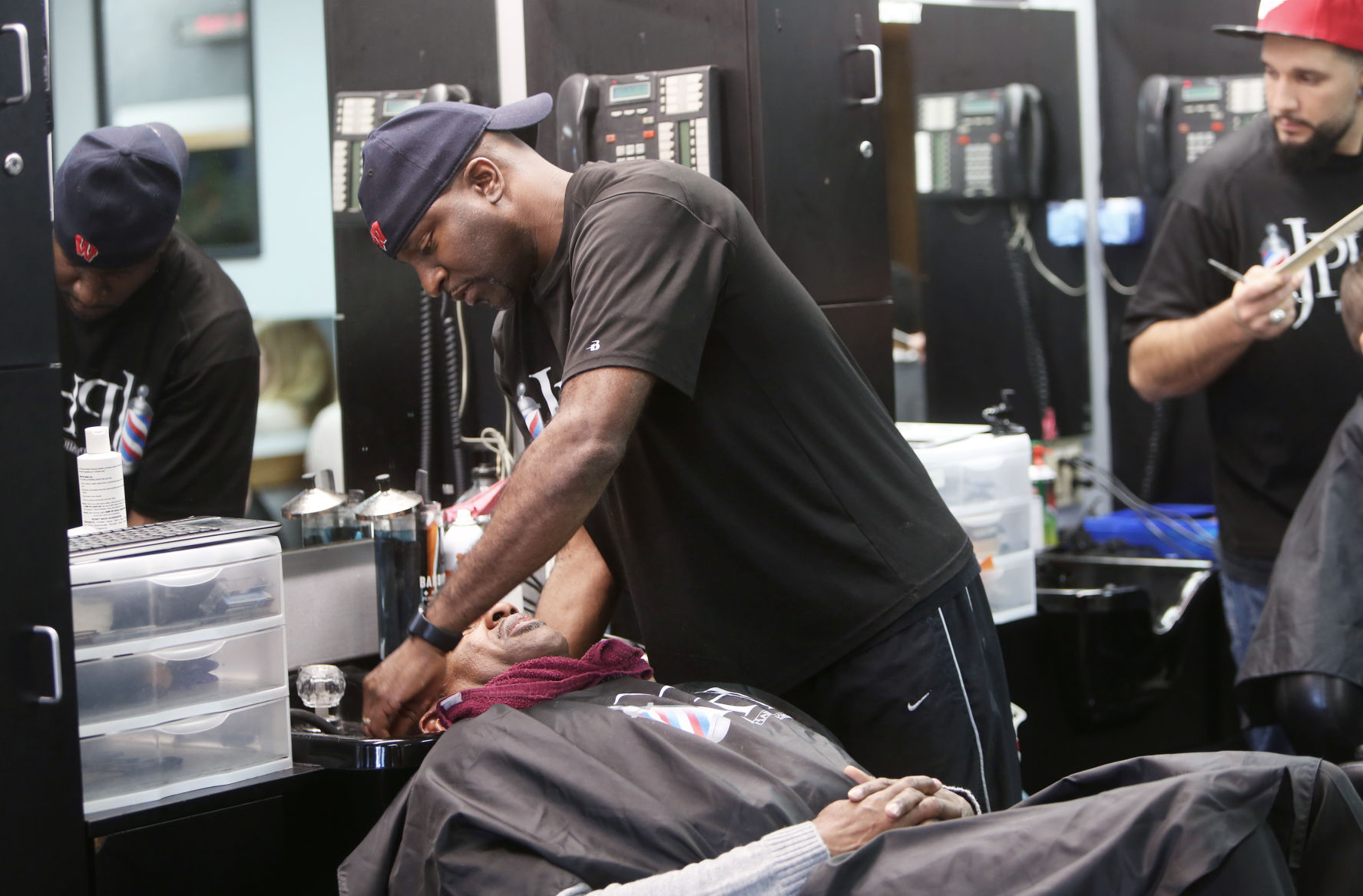 Jeff washing client's hair